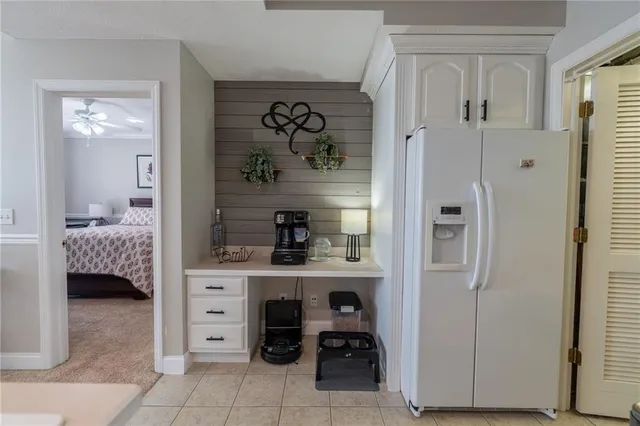 a view of a bedroom with a bed and a couch