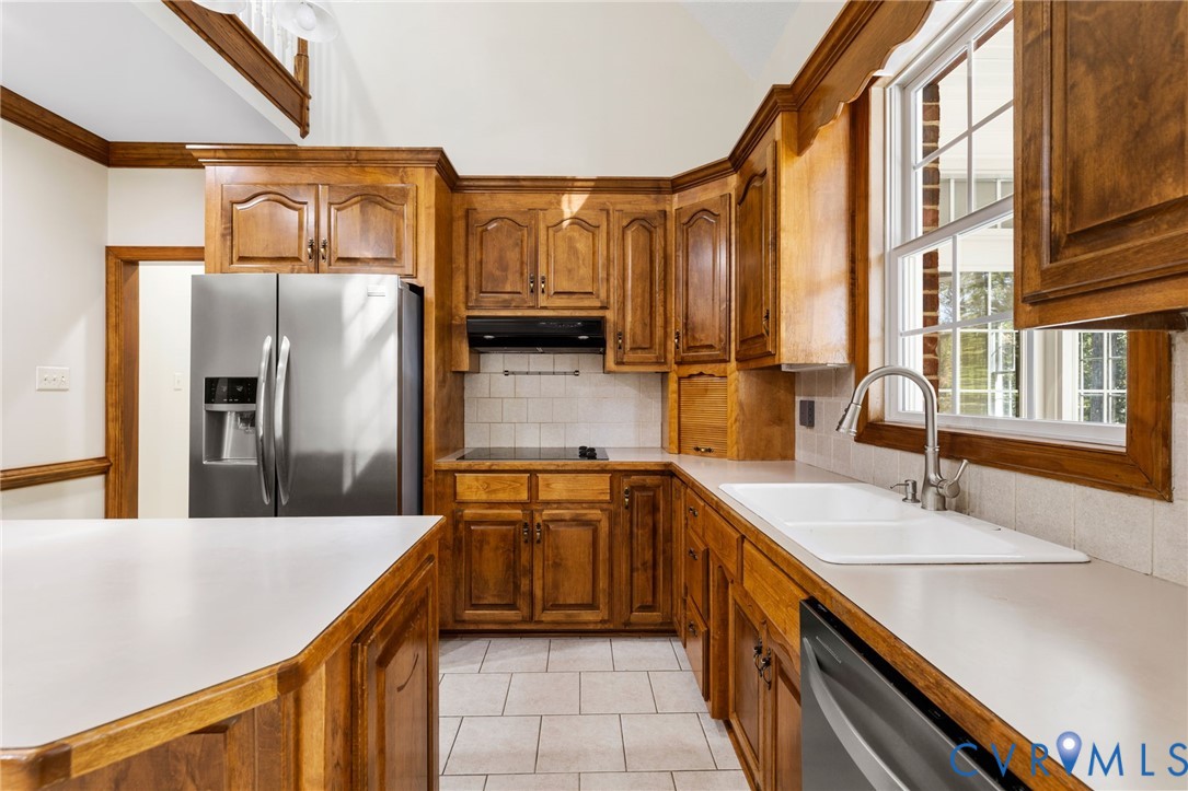 104 Petersburg Road Powhatan, VA 23139 - Photo 11 of 45 a kitchen with stainless steel appliances a sink and a refrigerator