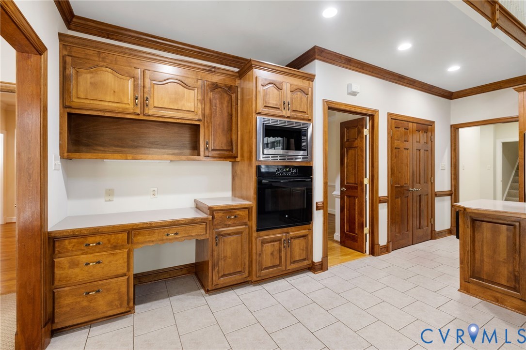 104 Petersburg Road Powhatan, VA 23139 - Photo 12 of 45 a kitchen with stainless steel appliances kitchen island granite countertop a refrigerator and cabinets