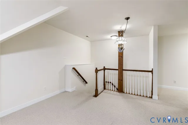 a view of an empty room with stairs