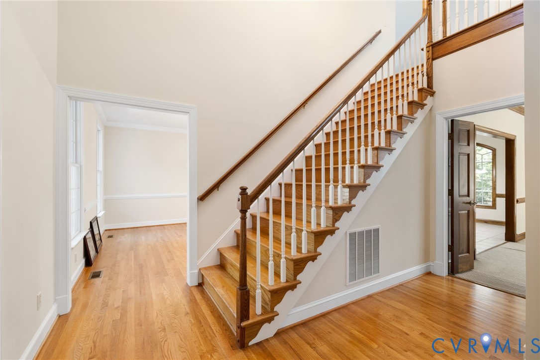 104 Petersburg Road Powhatan, VA 23139 - Photo 4 of 45 a view of entryway with wooden floor and stairs