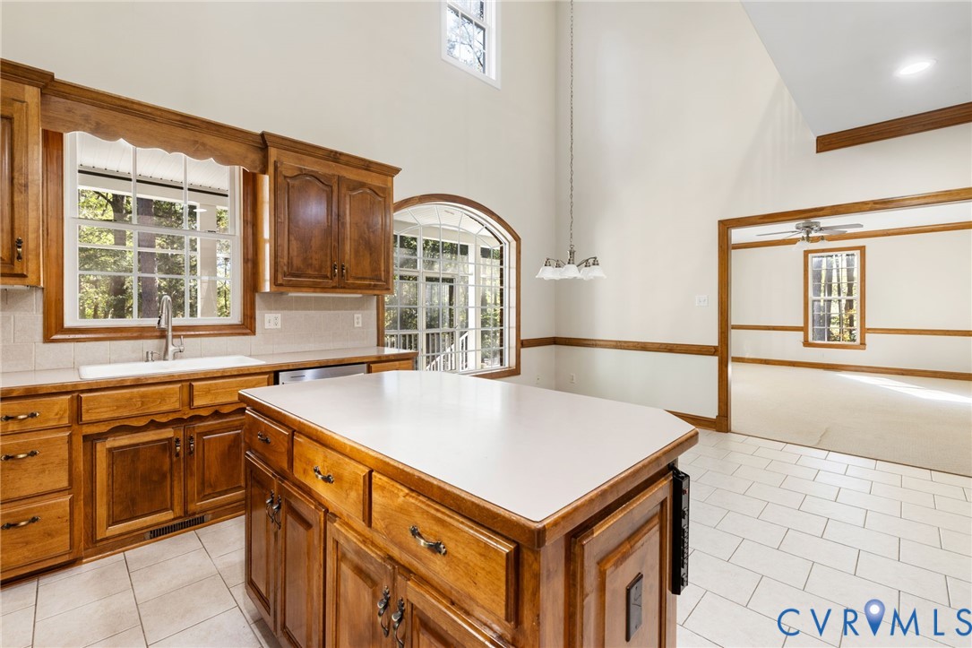 104 Petersburg Road Powhatan, VA 23139 - Photo 10 of 45 a kitchen with a sink a stove and cabinets