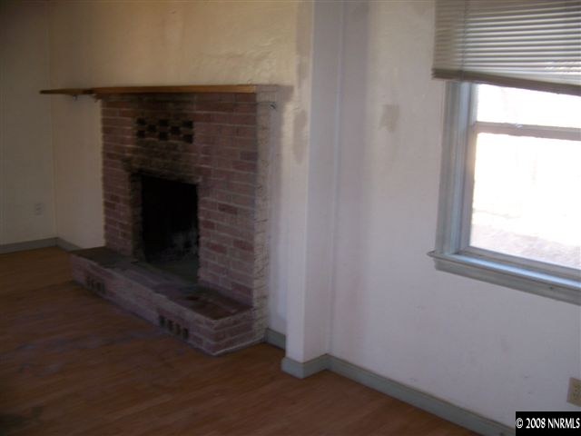1956 Citron Street Reno, NV 89512 - Photo 4 of 9 a room with a fireplace and a window