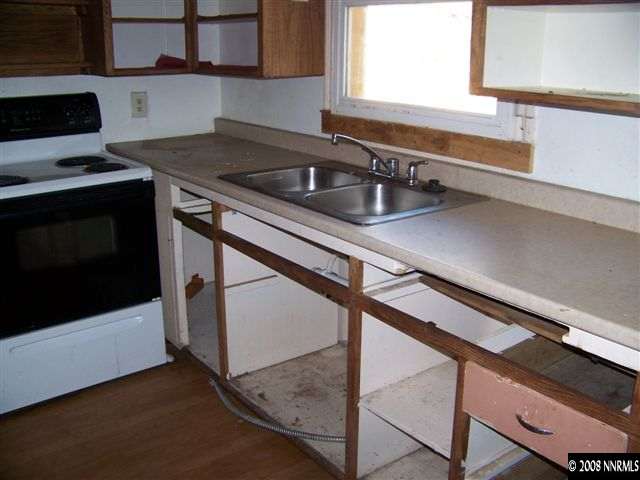 1956 Citron Street Reno, NV 89512 - Photo 5 of 9 a kitchen that has a sink and a stove