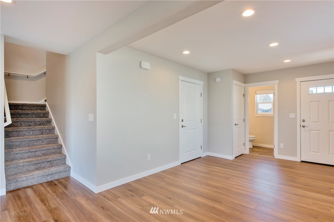 802 Nooksack Road Nooksack, WA 98276 - Photo 2 of 4 a view of an empty room with wooden floor and entryway