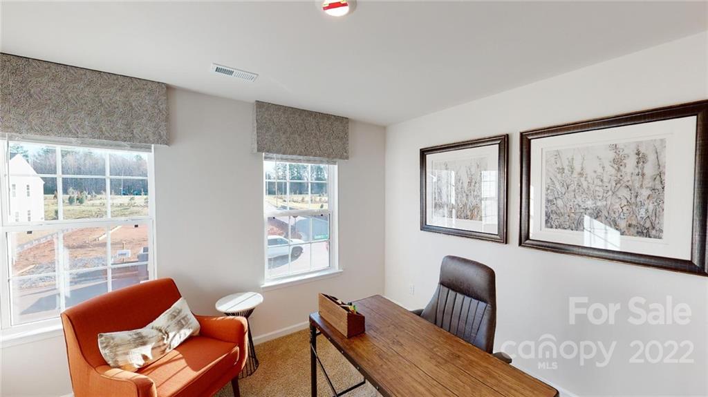 7588 Stonehouse Drive Gastonia, NC 28056 - Photo 14 of 20 a living room with furniture and a window