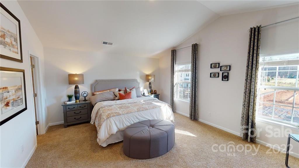 7588 Stonehouse Drive Gastonia, NC 28056 - Photo 15 of 20 a bedroom with a bed and a large window