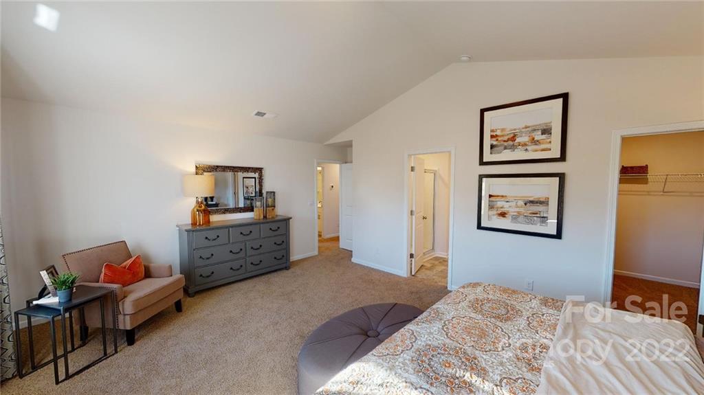 7588 Stonehouse Drive Gastonia, NC 28056 - Photo 16 of 20 a bedroom with furniture and baby bed