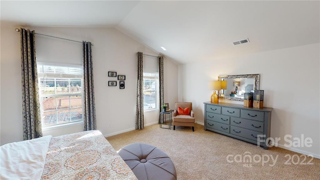 7588 Stonehouse Drive Gastonia, NC 28056 - Photo 17 of 20 a bedroom with furniture and a window