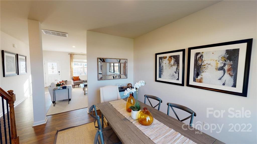 7588 Stonehouse Drive Gastonia, NC 28056 - Photo 6 of 20 a living room with furniture and wooden floor