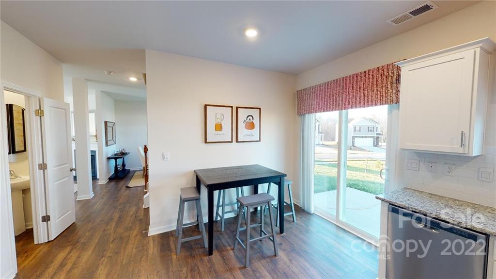 7588 Stonehouse Drive Gastonia, NC 28056 - Photo 9 of 20 a view of a kitchen and dining room