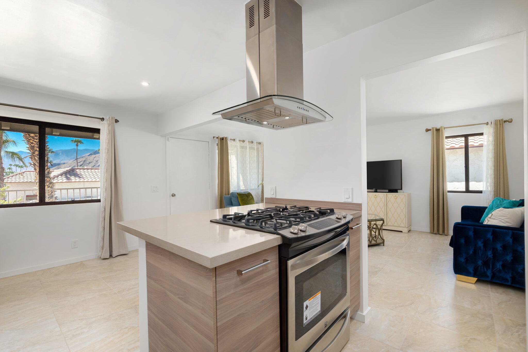 349 West Mariscal Road Palm Springs, CA 92262 - Photo 24 of 34 a kitchen with stainless steel appliances granite countertop a stove and a refrigerator