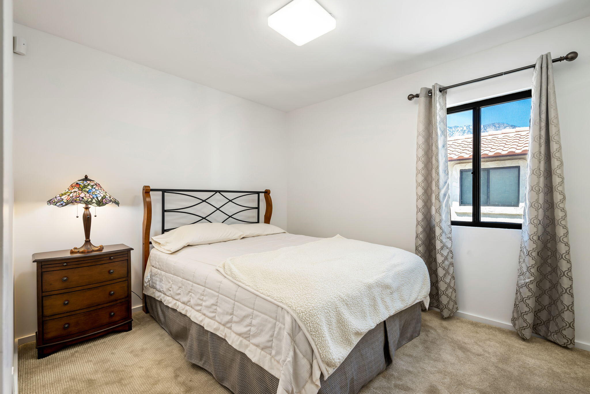 349 West Mariscal Road Palm Springs, CA 92262 - Photo 27 of 34 a bedroom with a bed and a window