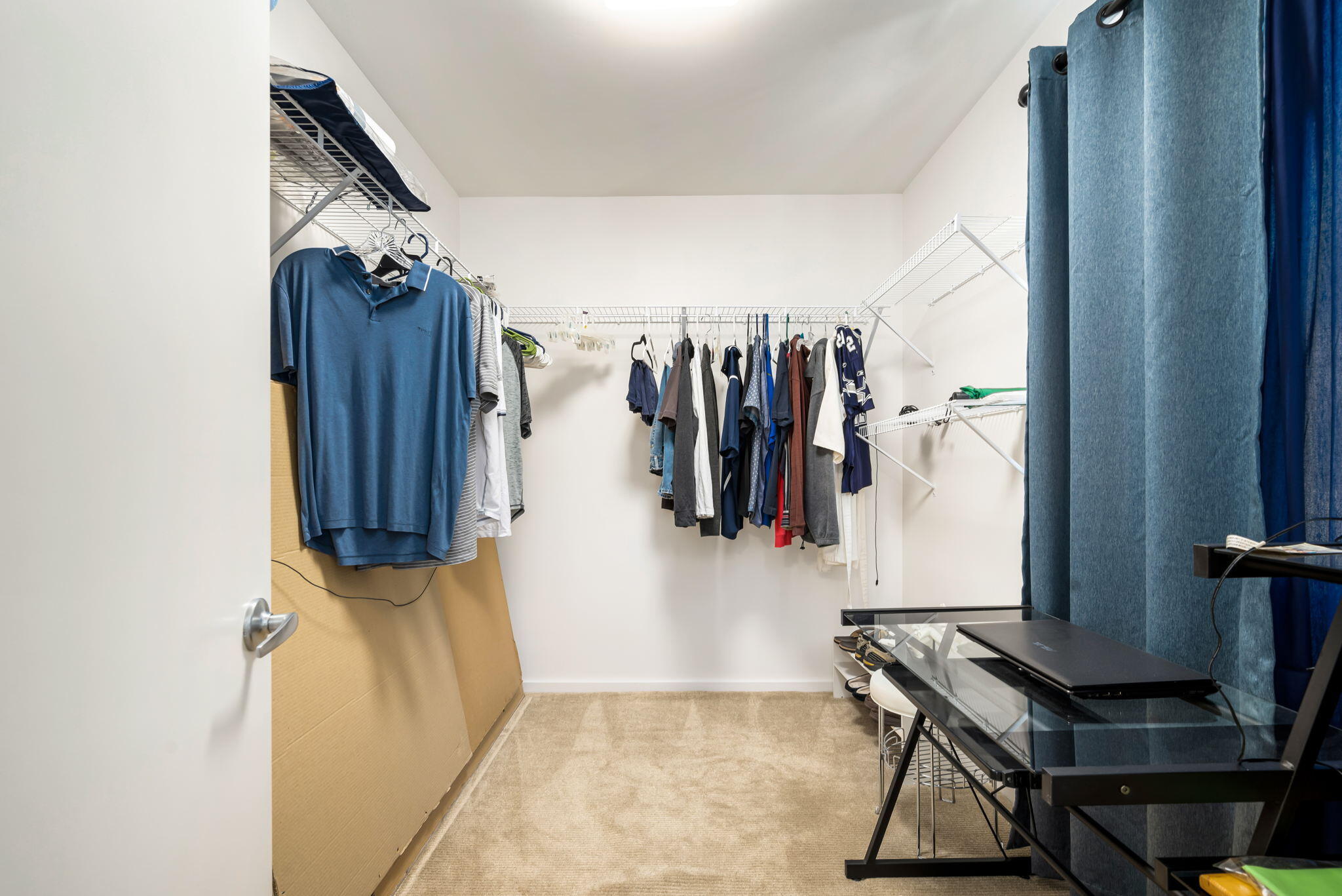 349 West Mariscal Road Palm Springs, CA 92262 - Photo 31 of 34 a view of walk in closet with clothes and shoes