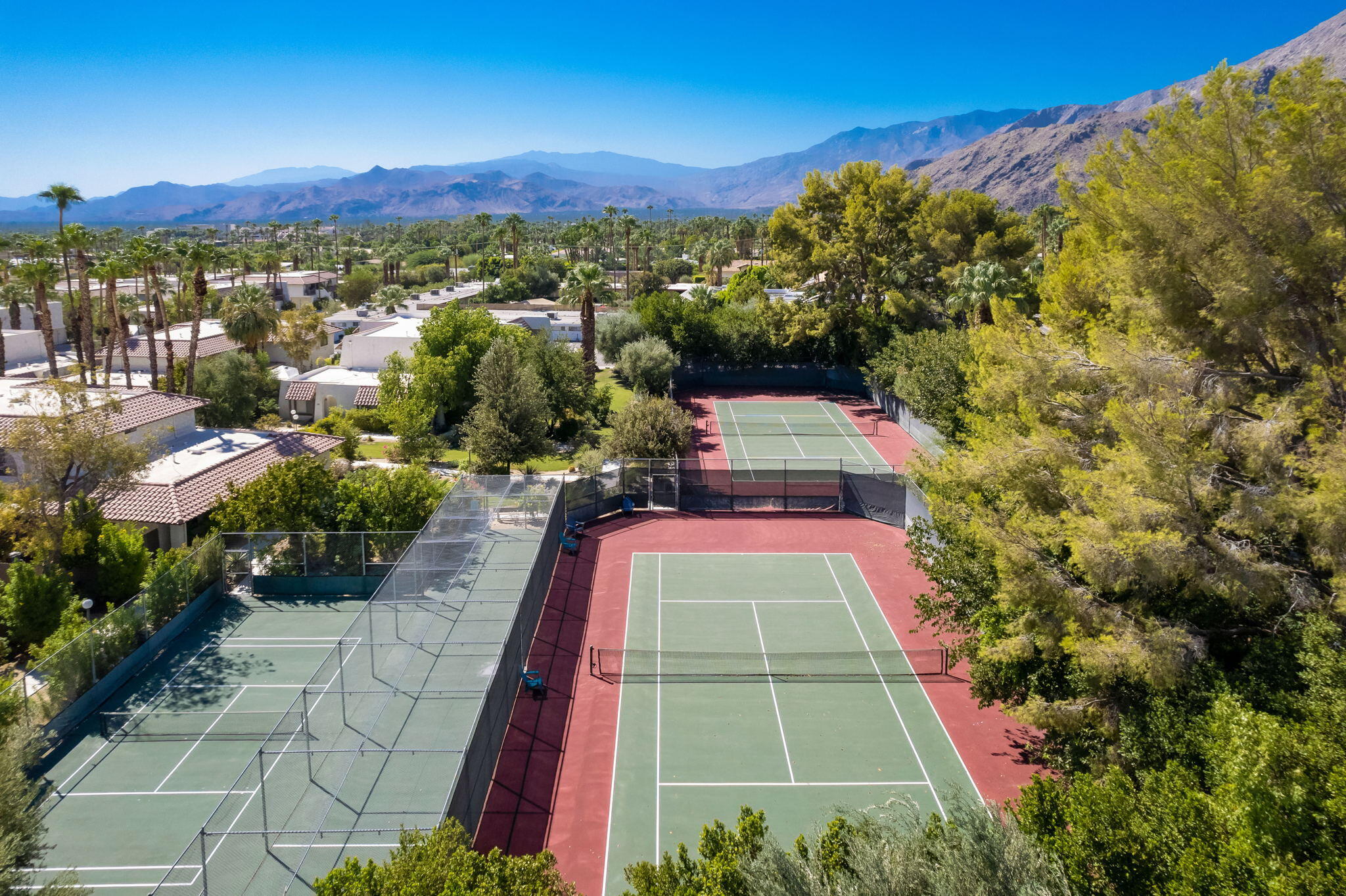 349 West Mariscal Road Palm Springs, CA 92262 - Photo 6 of 34 a view of a multi story residential apartment building with a yard