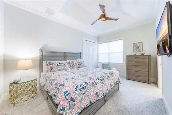 a bedroom with a bed dresser and a window