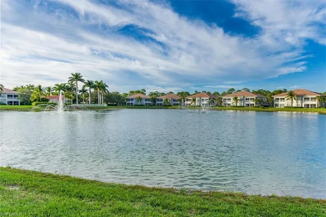 a view of a lake with houses in the back