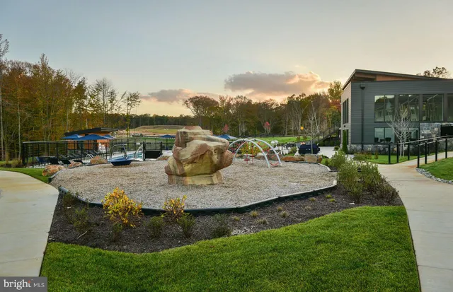 a view of a patio with swimming pool and sitting area