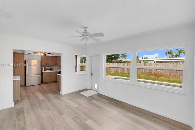 a view of an empty room with a bathroom