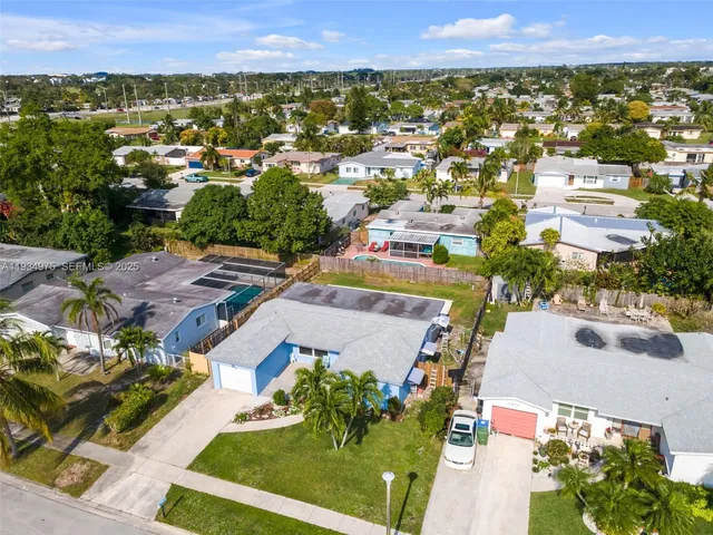 an aerial view of a house with a garden