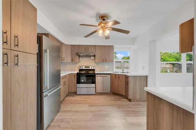 a kitchen with a refrigerator and a sink