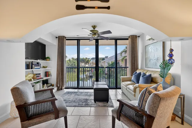 a bedroom with a large bed and a flat screen tv