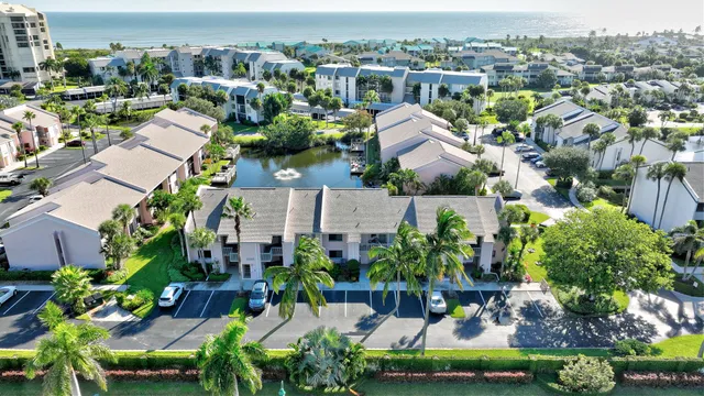 a front view of a building with a garden