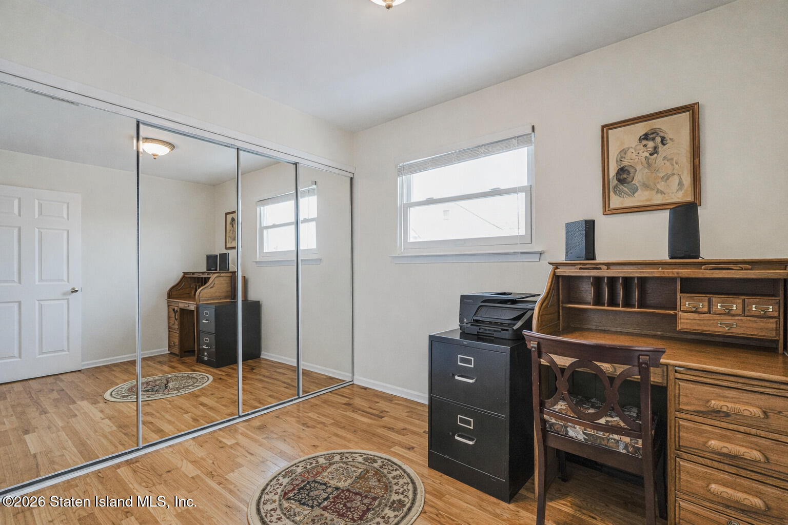 76 Berry Avenue Staten Island, NY 10312 - Photo 18 of 42 a bed room with a bed and a television