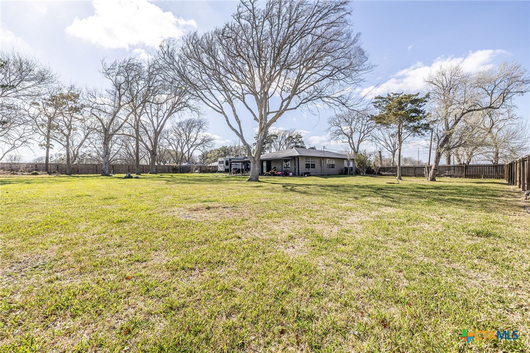 743 Royal Road Port Lavaca, TX 77979 - Photo 17 of 21 a view of a swimming pool and trees in the background