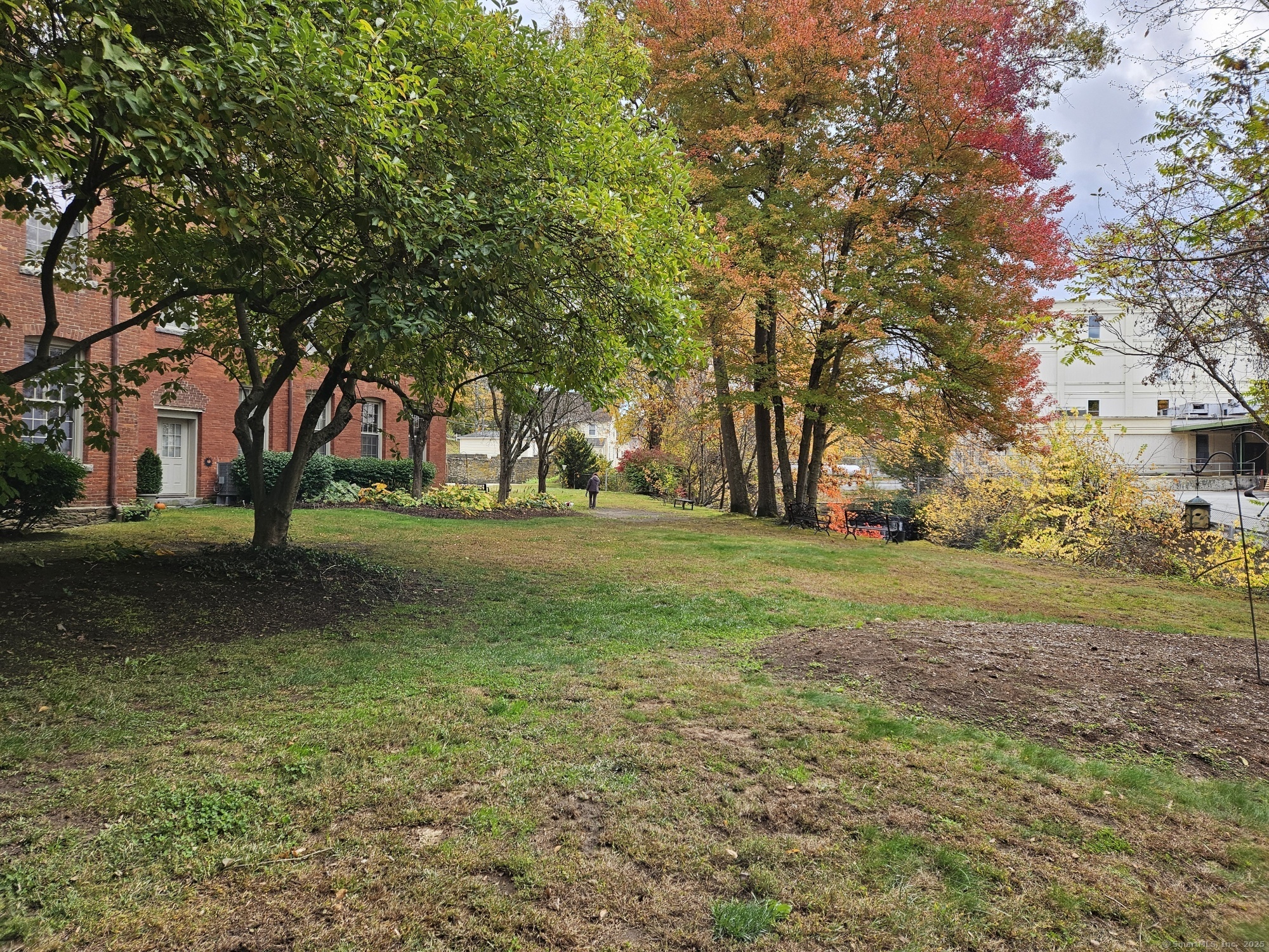 92 Main Street, Unit 101 Deep River, CT 06417 - Photo 13 of 16 a view of a tree in front of a house