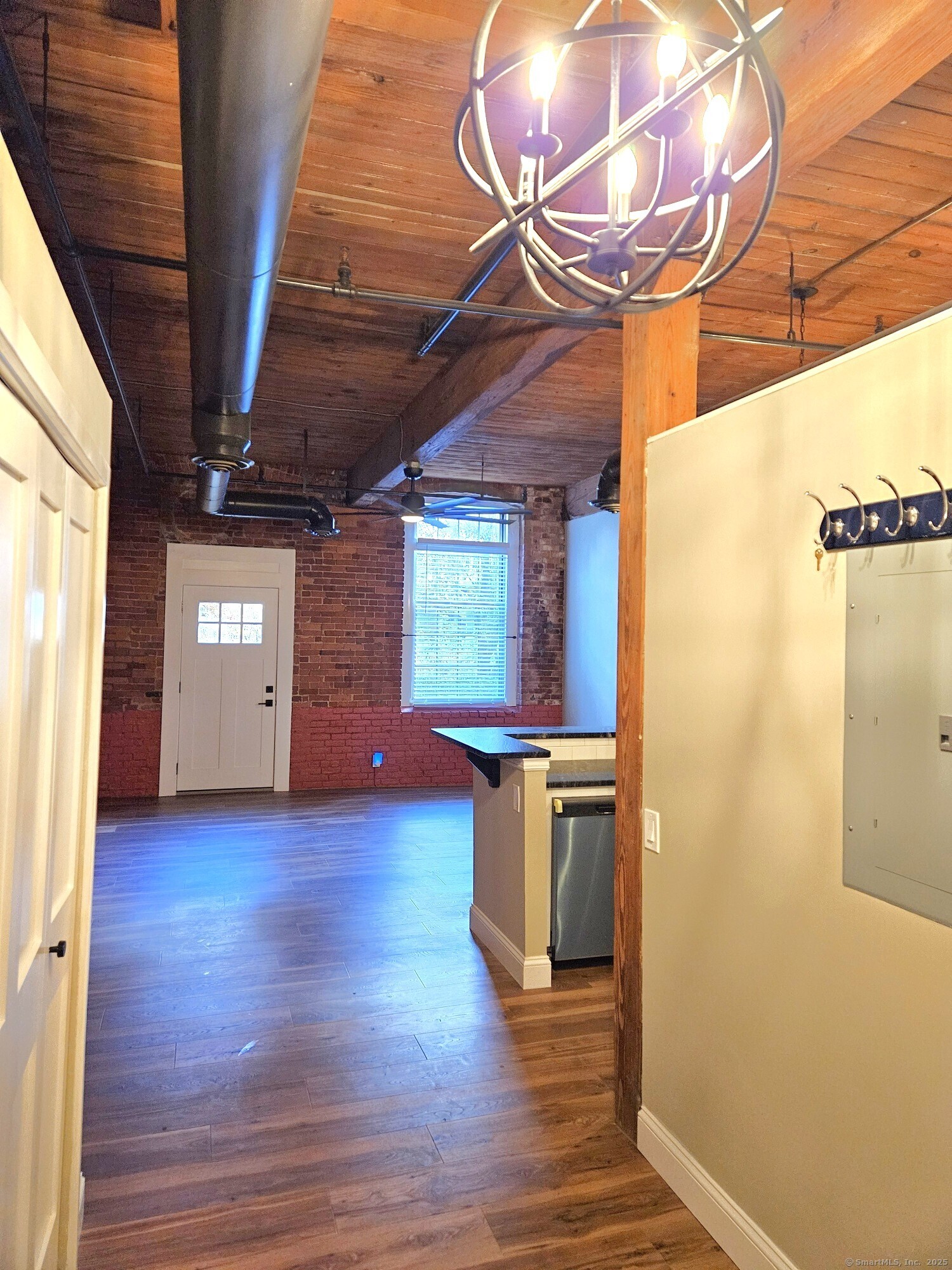 92 Main Street, Unit 101 Deep River, CT 06417 - Photo 2 of 16 a view of a room with wooden floor and windows