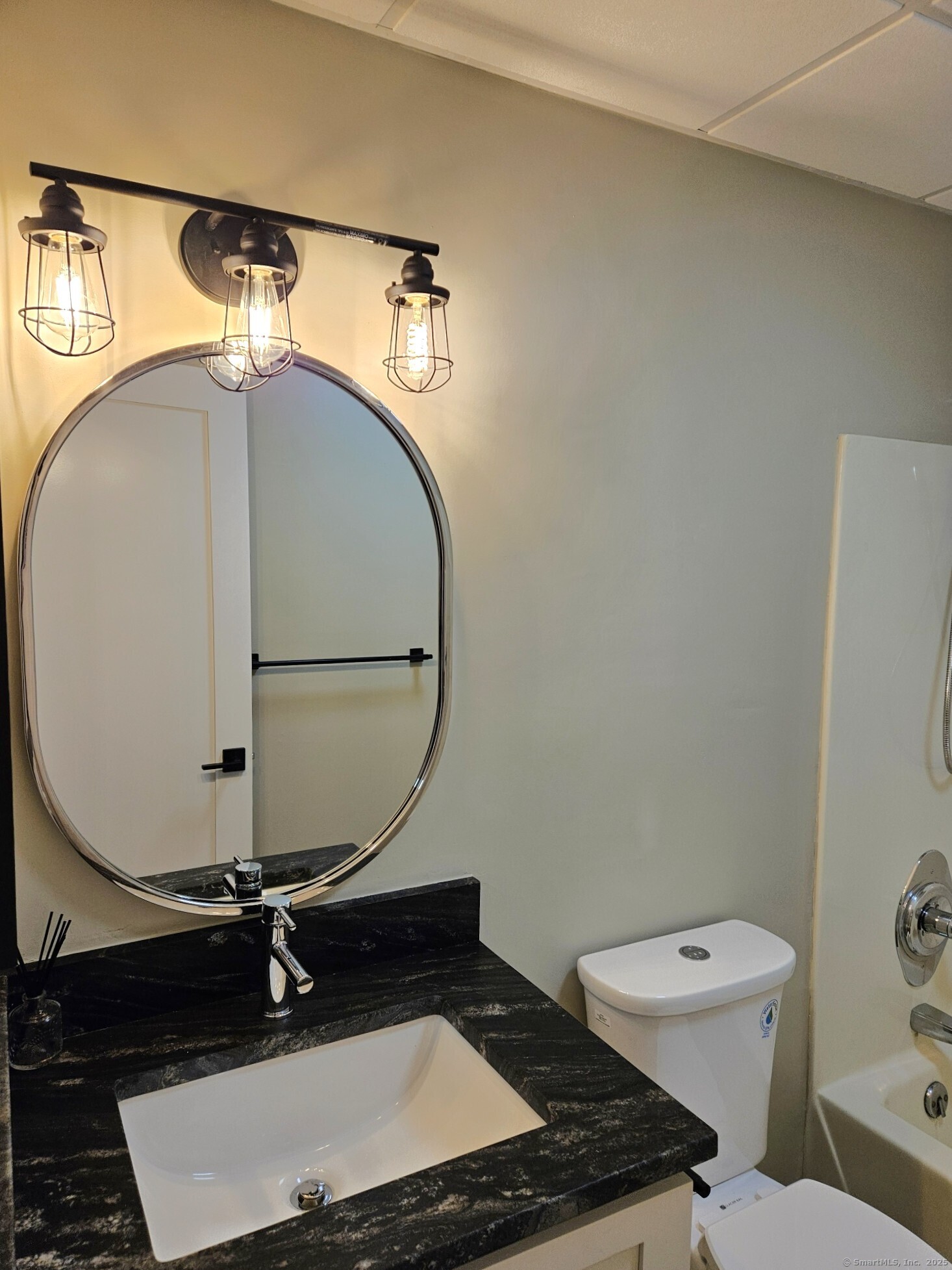 92 Main Street, Unit 101 Deep River, CT 06417 - Photo 4 of 16 a bathroom with a toilet and a mirror