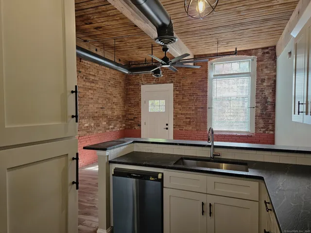 a kitchen with a sink and a window