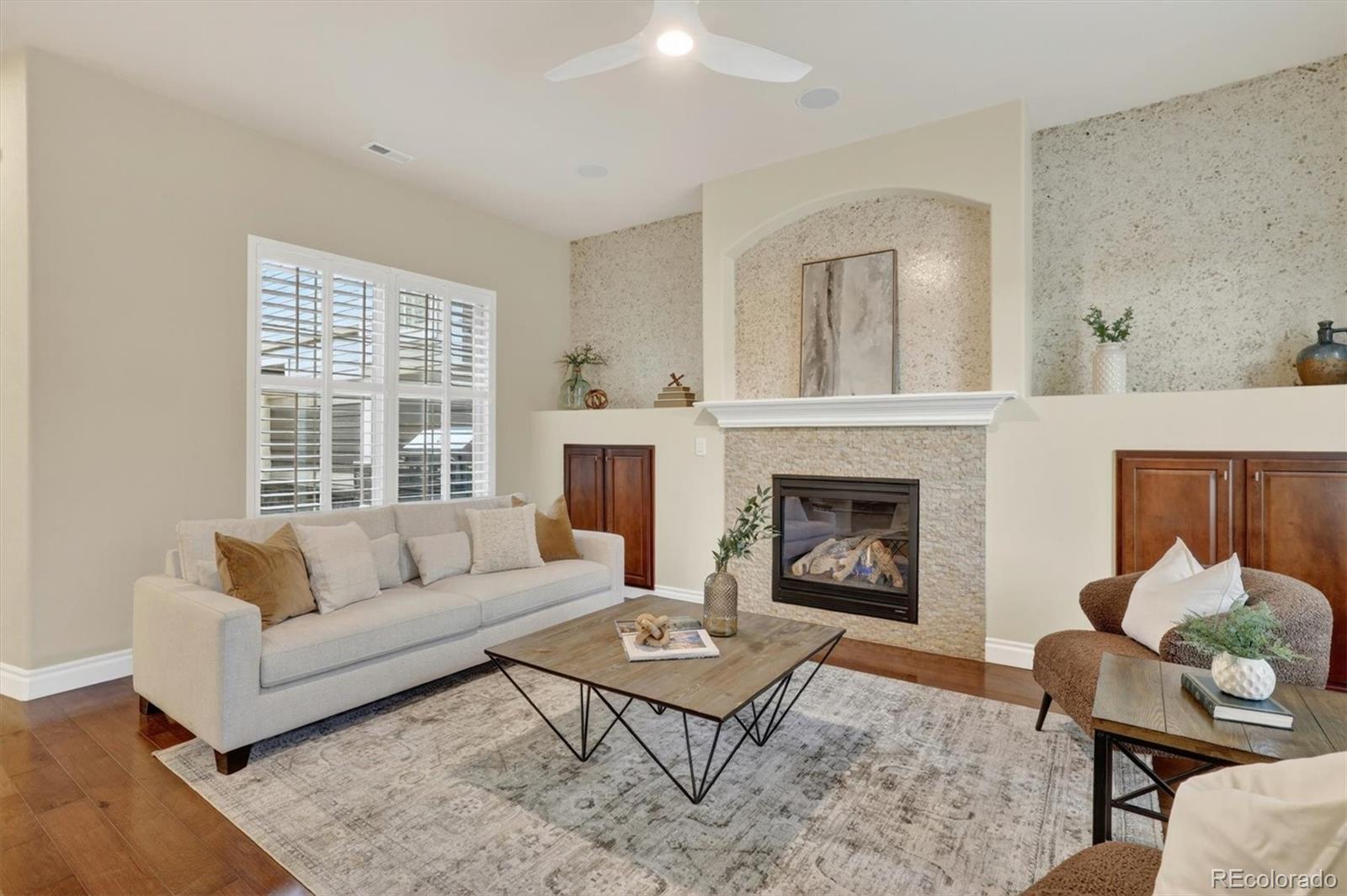 10126 RidgeGate Circle Lone Tree, CO 80124 - Photo 4 of 32 a living room with furniture fireplace and window
