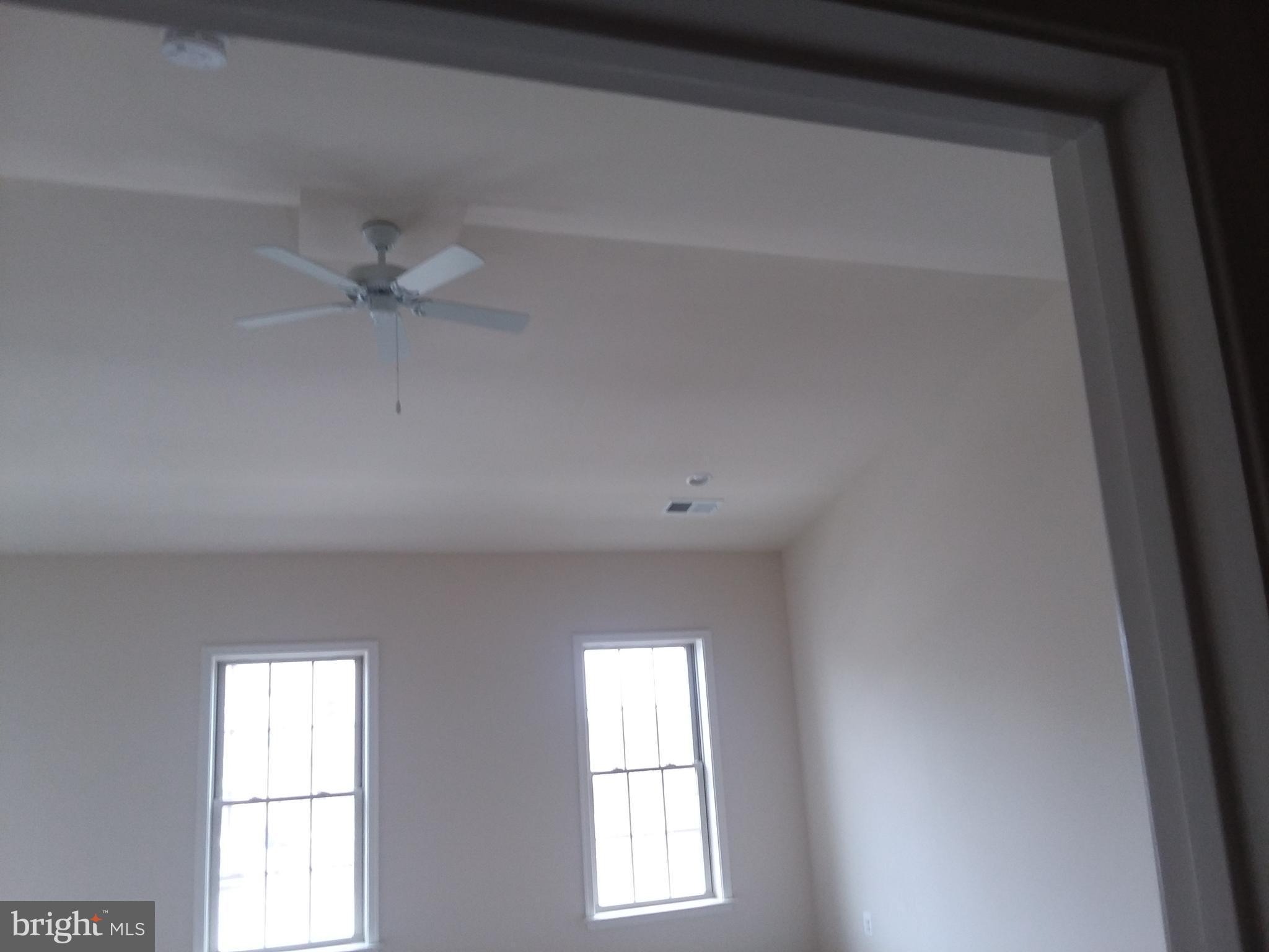 22595 Windsor Locks Square Ashburn, VA 20148 - Photo 19 of 56 an empty room with windows and fan