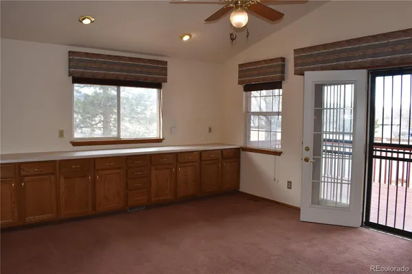 a view of an empty room with a window