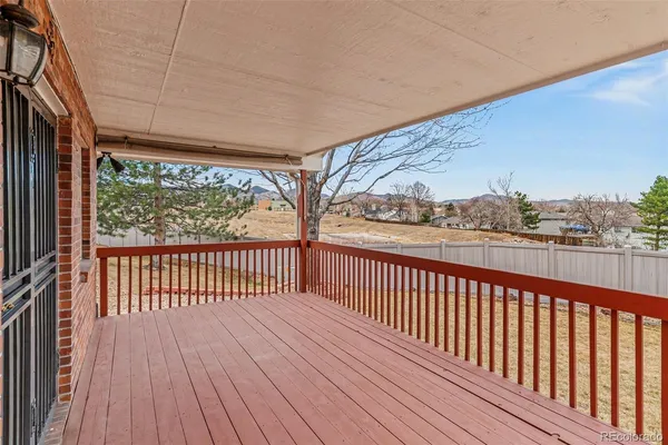 a view of balcony with wooden floor