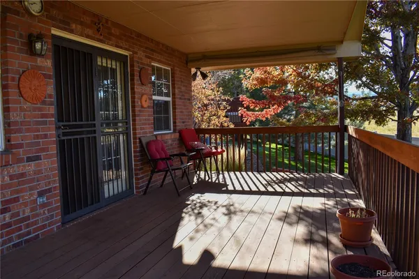 a view of a two chairs in the balcony