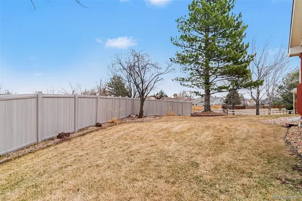 a view of a backyard of the house