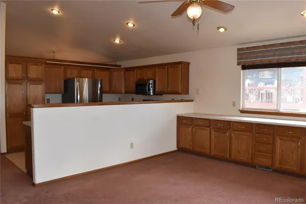 a kitchen with sink cabinets and window