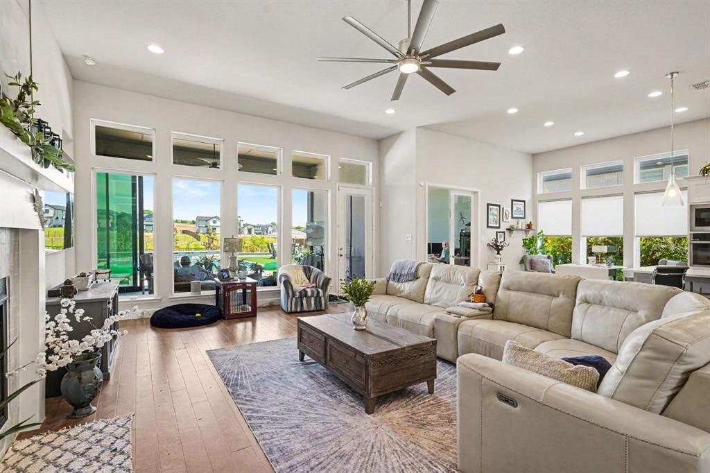 573 Broadleaf Way Haslet, TX 76052 - Photo 14 of 35 a living room with furniture ceiling fan and a large window