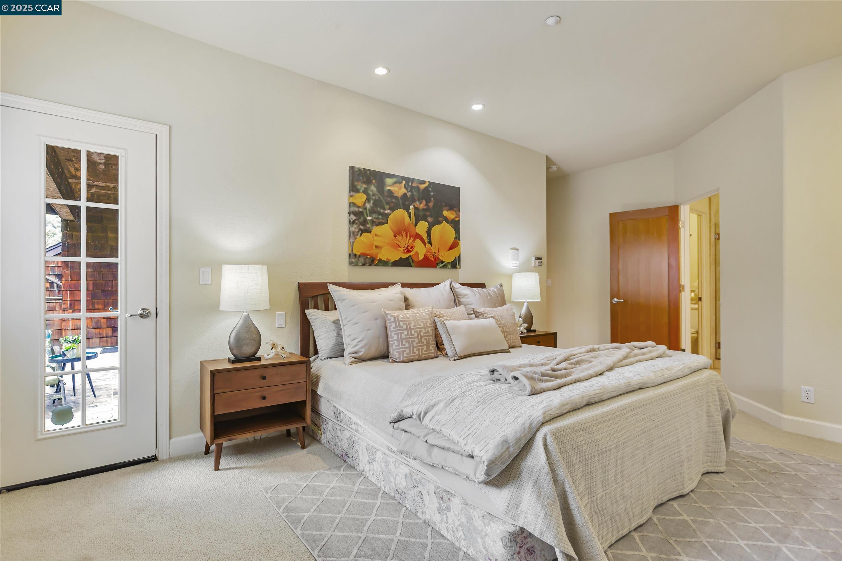 1215 Alvarado Road Berkeley, CA 94705 - Photo 27 of 52 a bedroom with bed and night stand