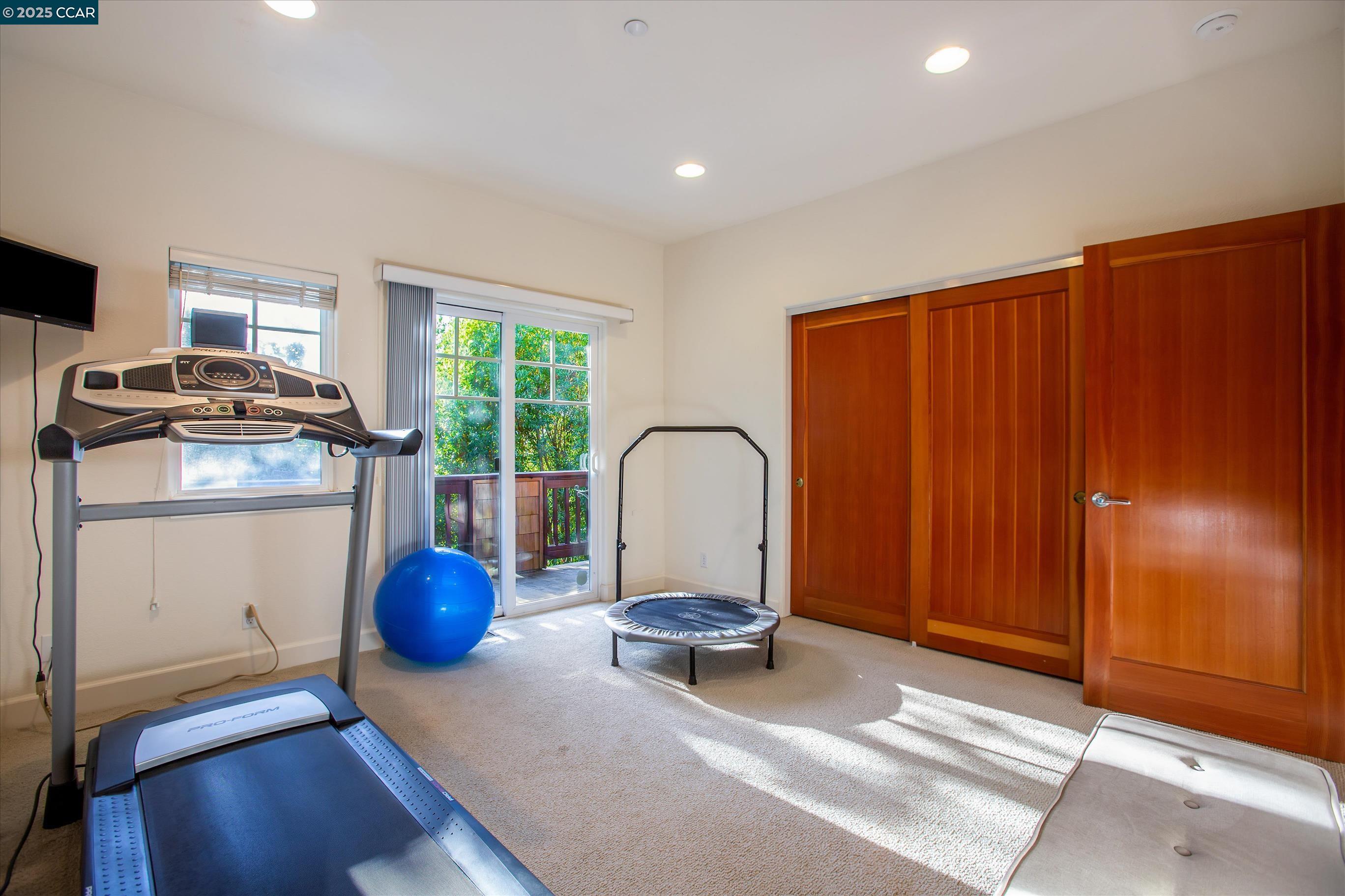 1215 Alvarado Road Berkeley, CA 94705 - Photo 32 of 52 a living room with furniture a window and wooden floors