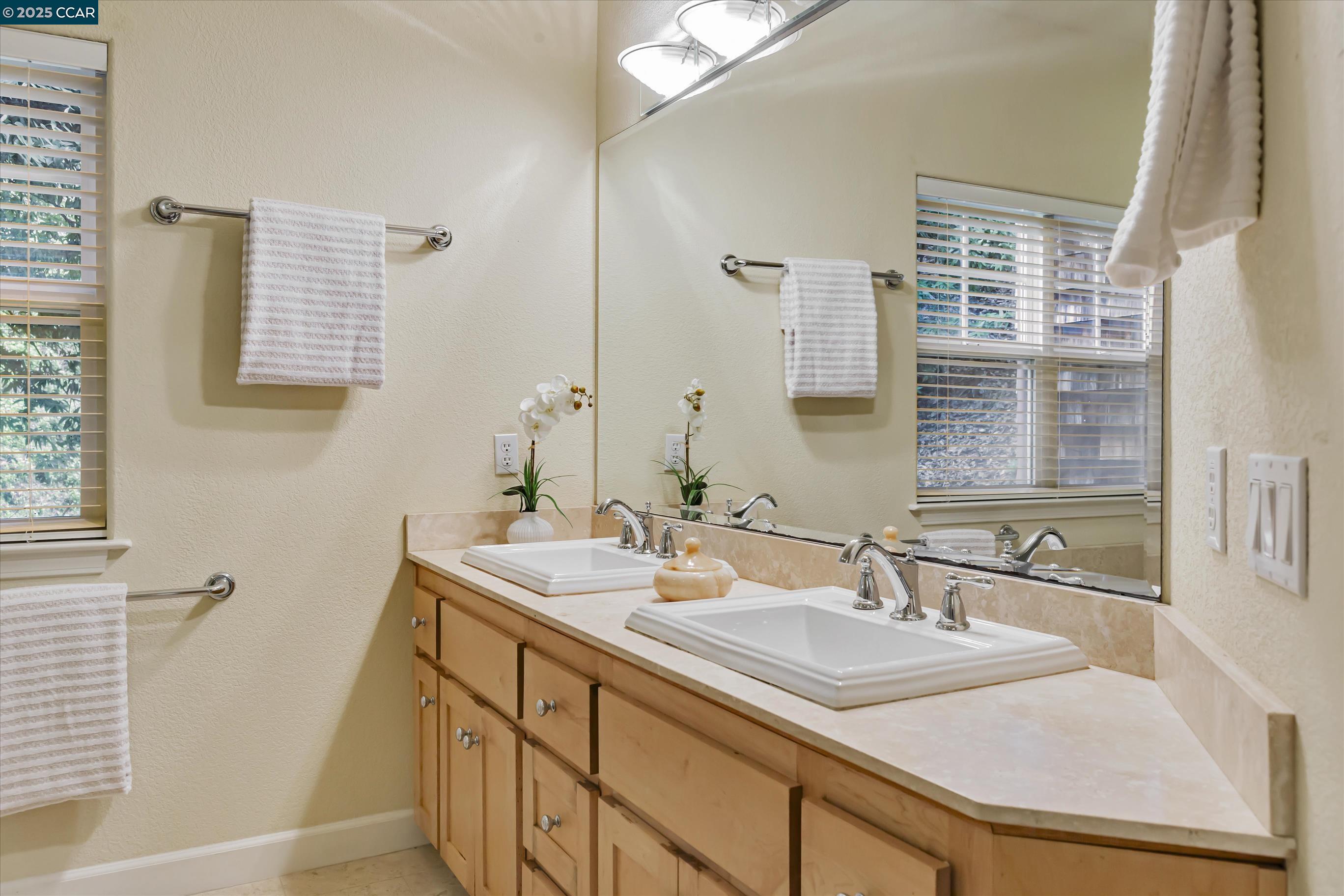 1215 Alvarado Road Berkeley, CA 94705 - Photo 38 of 52 a bathroom with a sink and a mirror