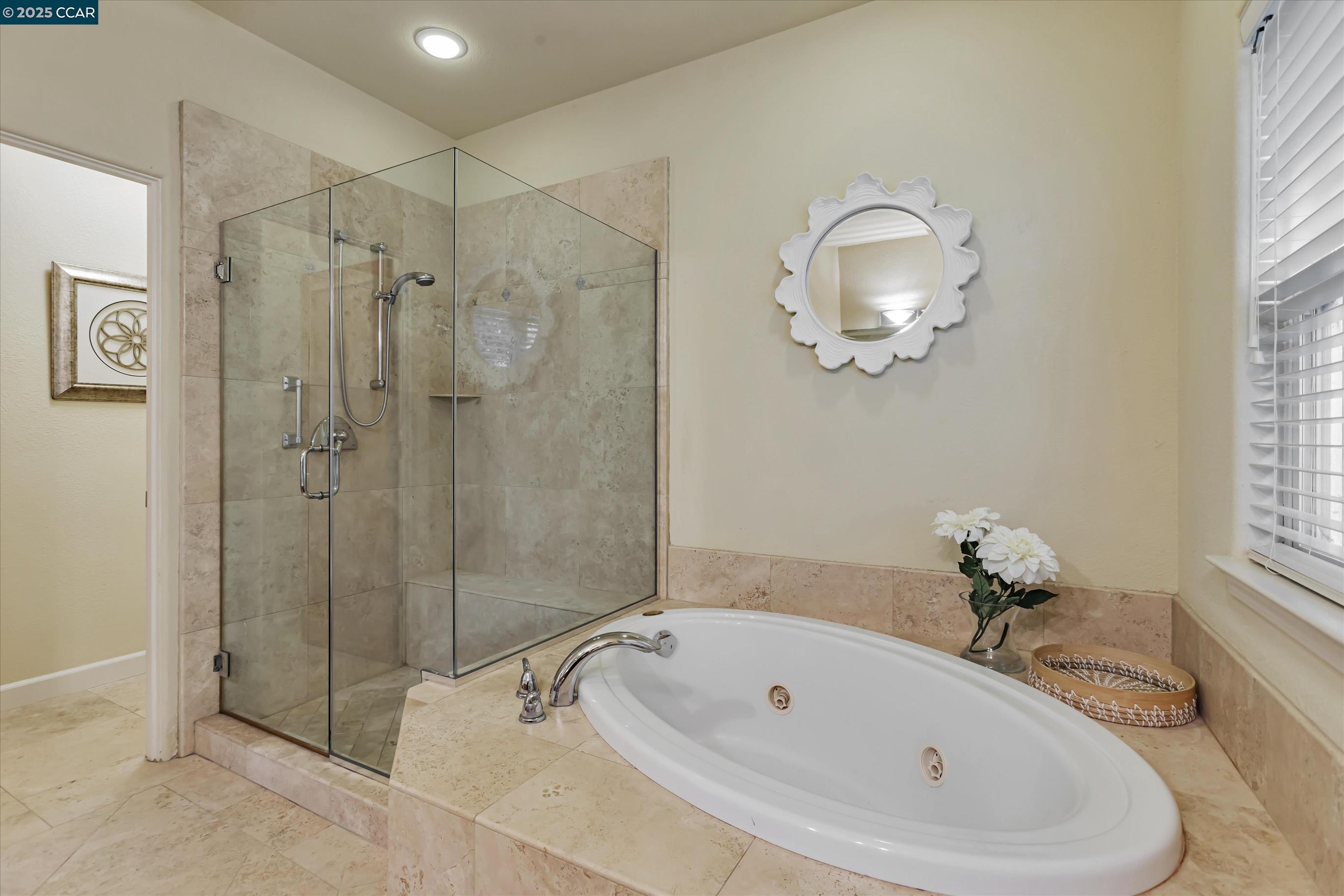 1215 Alvarado Road Berkeley, CA 94705 - Photo 40 of 52 a bathroom with a tub sink and glass door shower