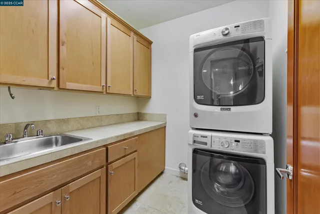 a view of roof deck with chair and wooden fence