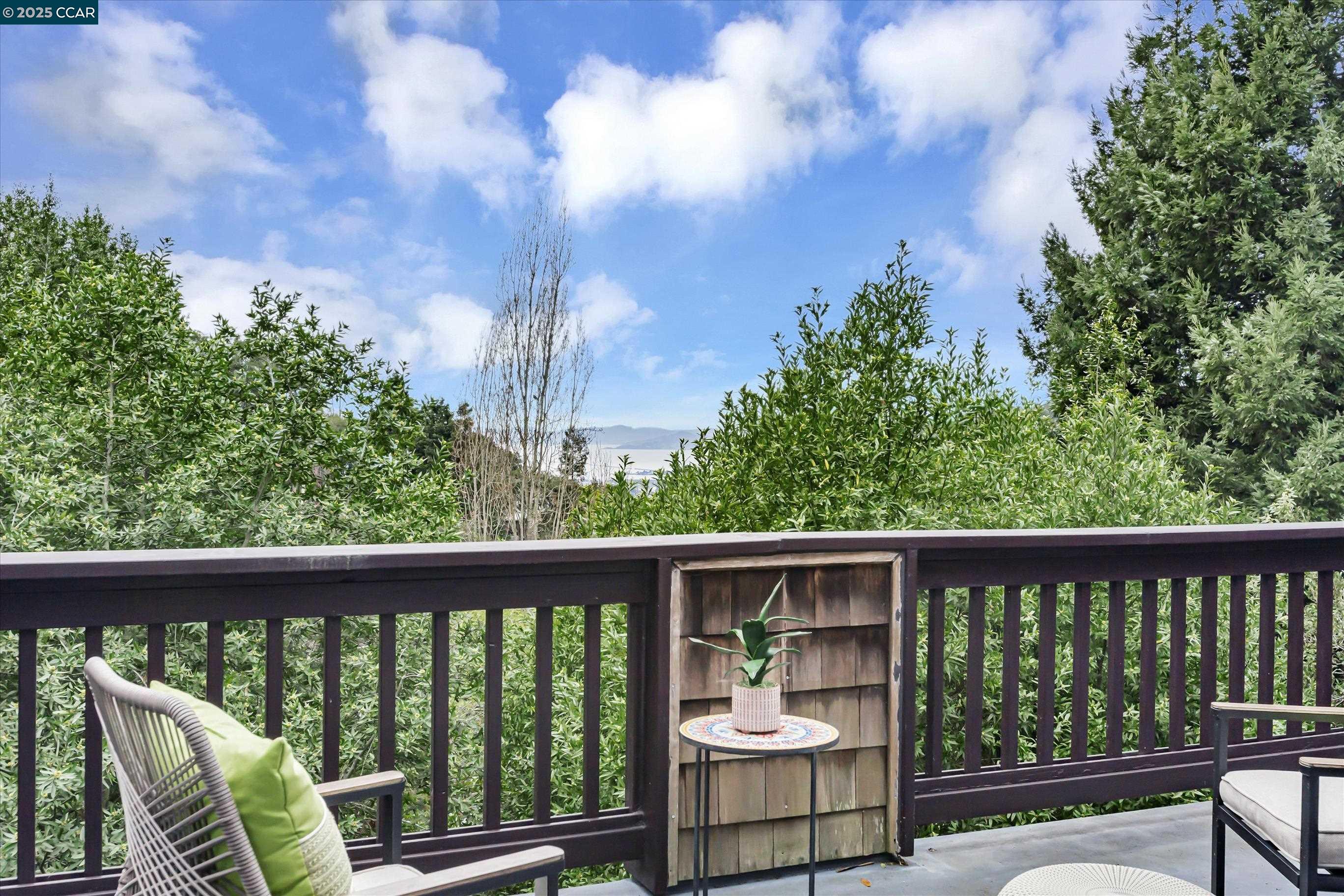 1215 Alvarado Road Berkeley, CA 94705 - Photo 43 of 52 a view of roof deck with chair and wooden fence