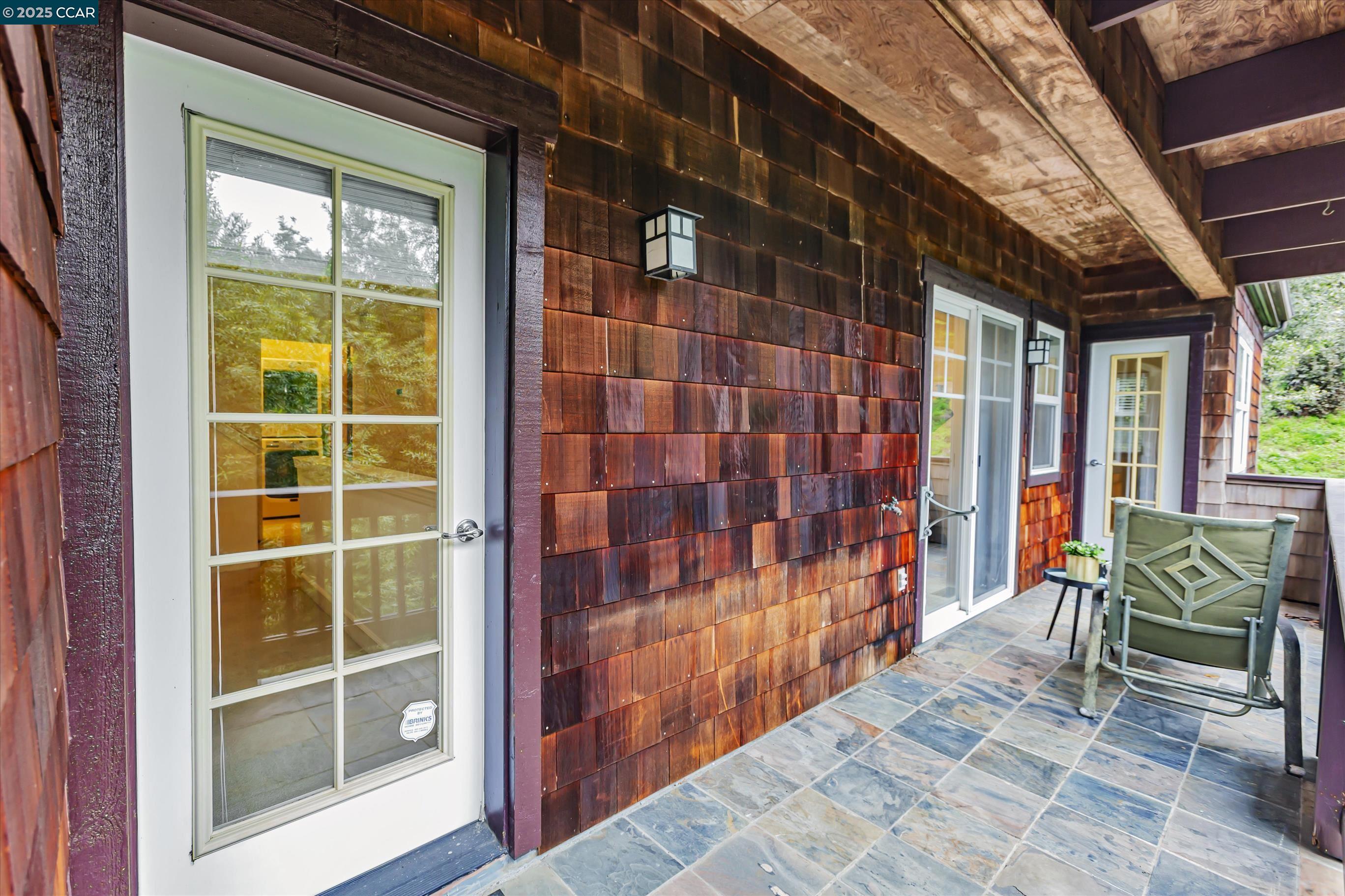 1215 Alvarado Road Berkeley, CA 94705 - Photo 46 of 52 a view of a porch with a door and a chair