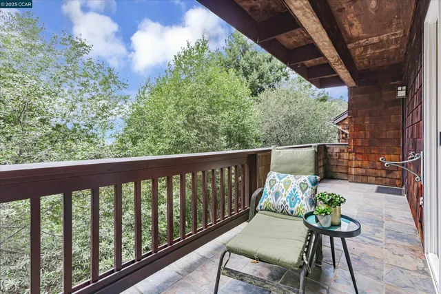 a view of brick house with potted plants