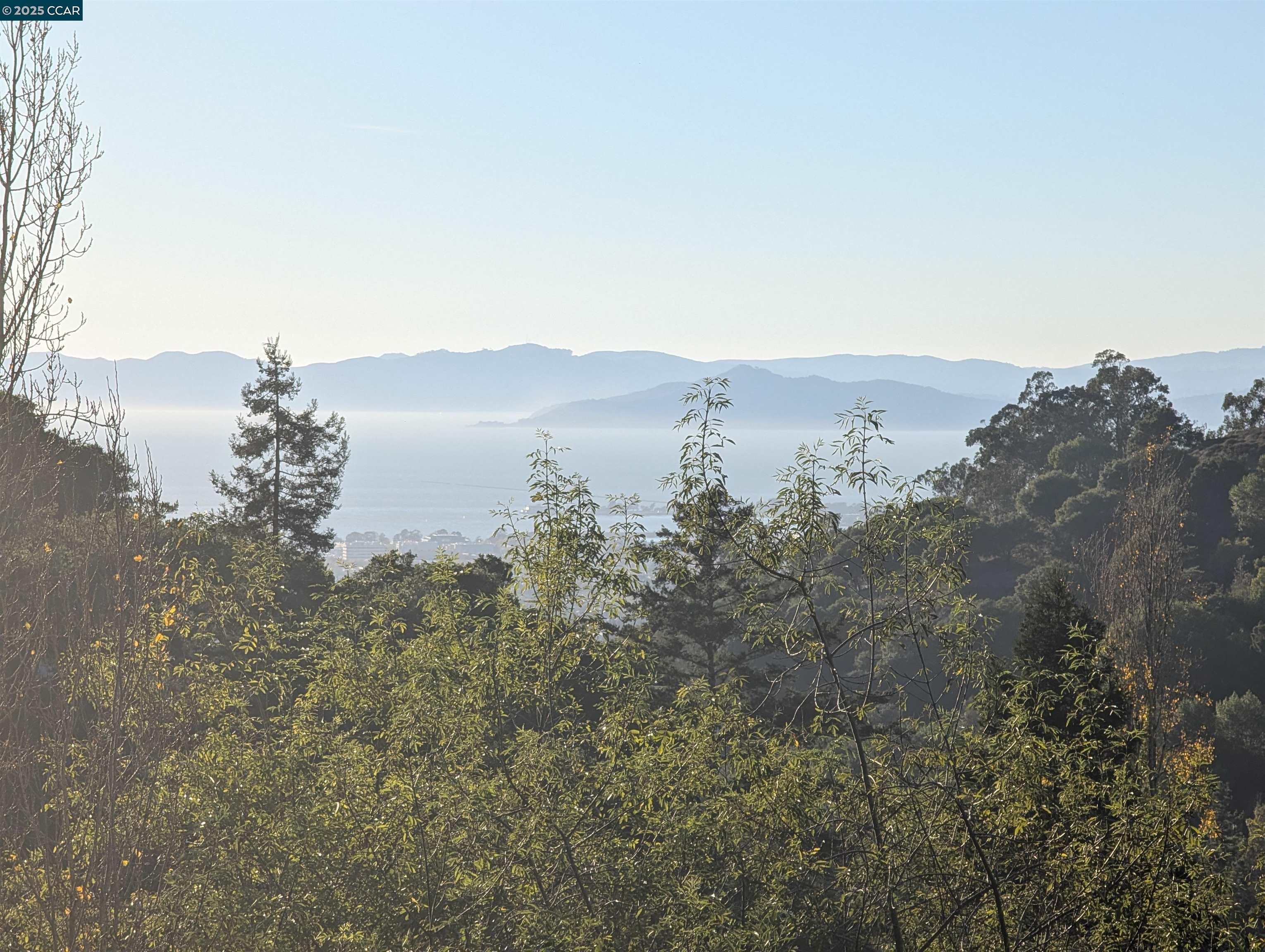1215 Alvarado Road Berkeley, CA 94705 - Photo 5 of 52 a view of a lake with a mountain in the background